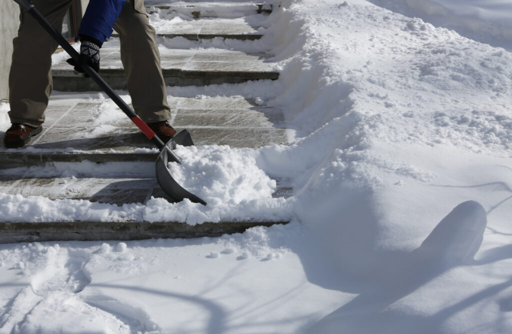 Winter blizzard: Cleaning the stairway